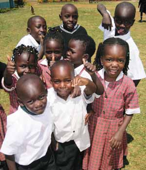 Children with their thumbs up, having fun